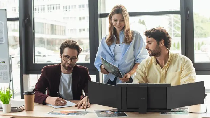 A triple monitor setup can also be called a laptop screen extender since that is what it does. Designed solely to duplicate, or in this case, give two extra screens