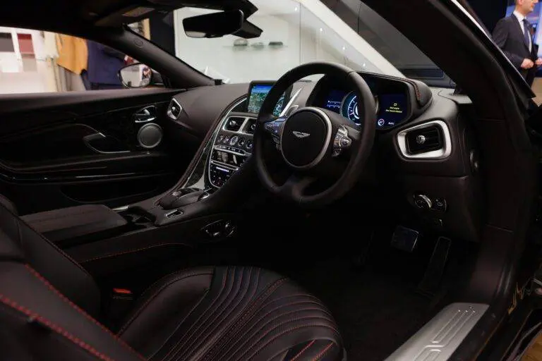 Delays in the production of its new DB12 model have led Aston Martin Lagonda to cut volume targets for the year.
