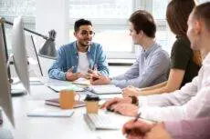 Multy-ethnic,Group,Of,Creative,Business,People,Sitting,At,The,Office