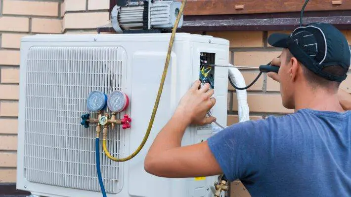 The,Worker,Installs,The,Outdoor,Unit,Of,The,Air,Conditioner
