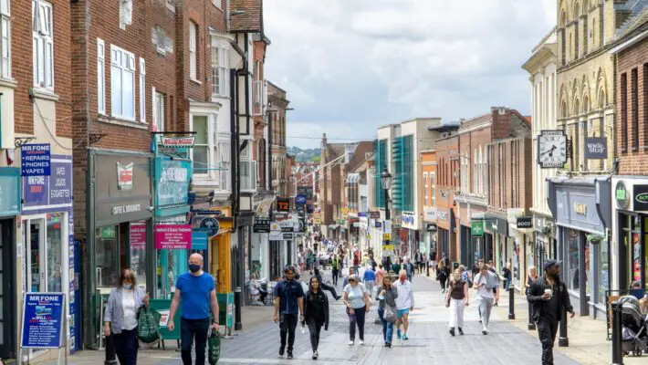 Retail prices in the UK have dropped for the first time in nearly three years, as retailers heavily discounted summer stock, particularly in fashion and household goods sectors.