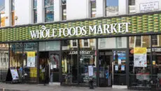 Amazon is dusting itself off for another tilt at Britain's fiercely competitive grocery sector, this time by converting its abandoned Fresh convenience stores into outlets for Whole Foods Market, the organic chain it acquired for $13.7 billion in 2017.