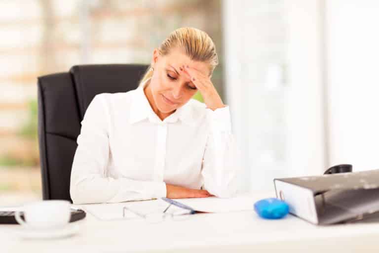 middle aged businesswoman looking worried