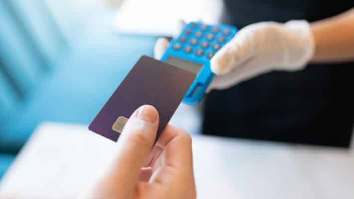 Customer Paying Through Credit Card In Restaurant