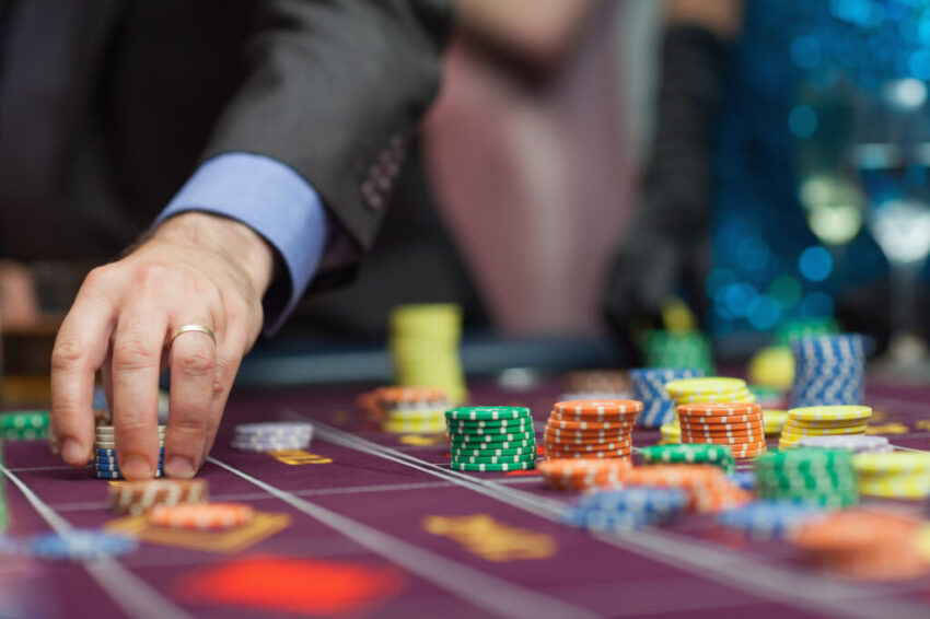 Man placing a bet at the casino