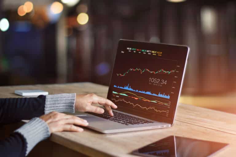 Businessman,Using,Laptop,For,Analyzing,Data,Stock,Market,,Forex,Trading