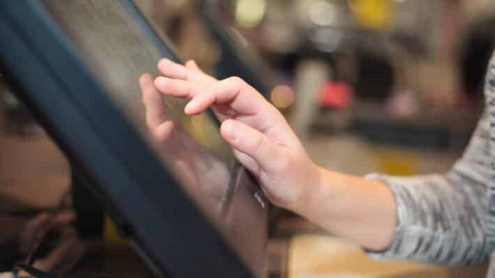 Young,Woman,Hand,Charging,A,Payment,For,A,Some,Clothes