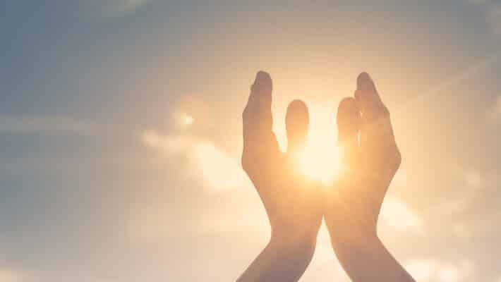 Woman,Hands,Holding,The,Sun,At,Dawn.,Freedom,And,Spirituality