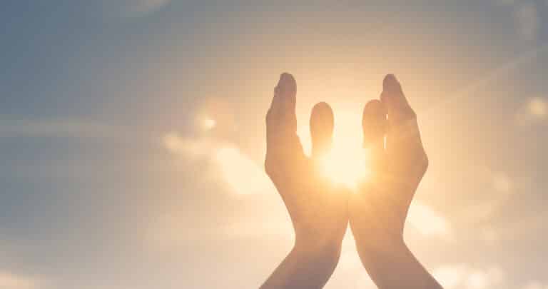 Woman,Hands,Holding,The,Sun,At,Dawn.,Freedom,And,Spirituality