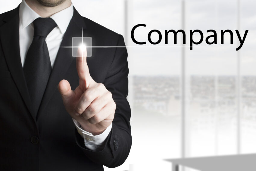 Businessman,In,Black,Suit,Pressing,Touchscreen,Button,Company