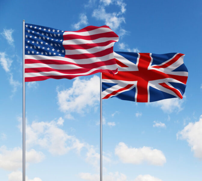 Uk,And,Usa,Flags,On,A,Blue,Sky,Background.