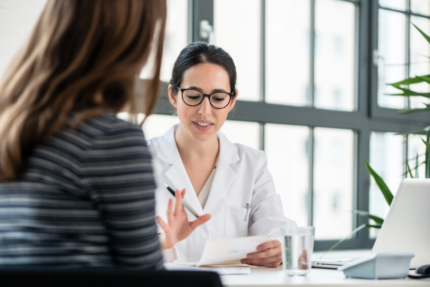 Female,Physician,Listening,To,Her,Patient,During,Consultation,While,Sitting