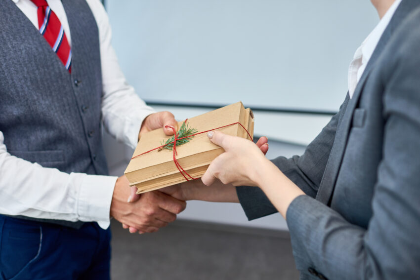 Close,Up,View,Of,Unrecognizable,Businessman,Shaking,Hands,With,Female