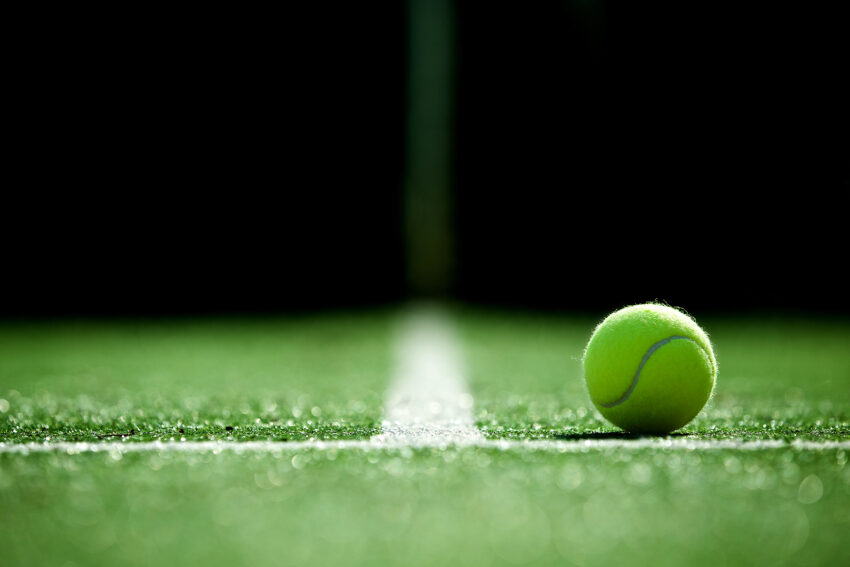 Soft,Focus,Of,Tennis,Ball,On,Tennis,Grass,Court