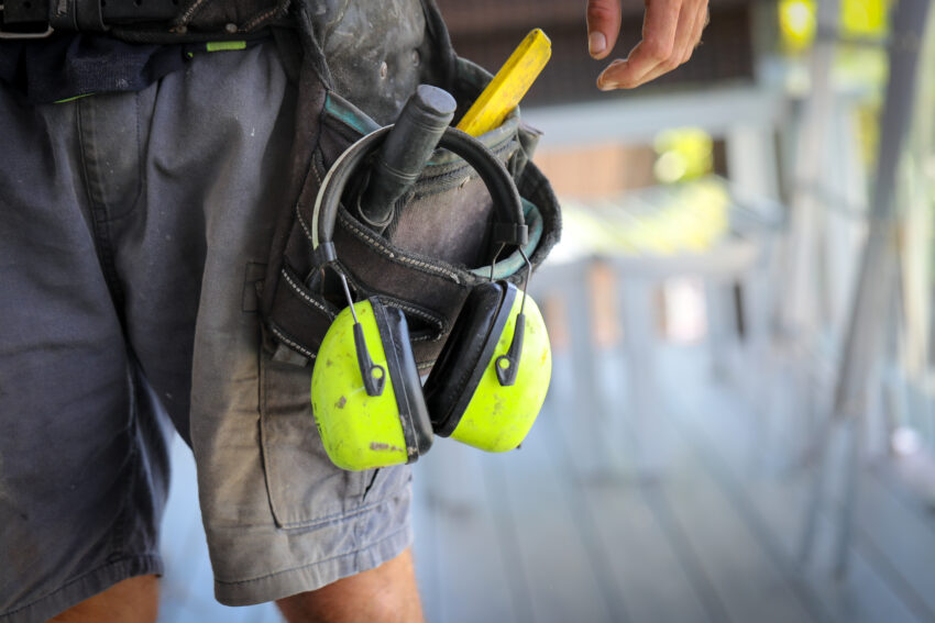 A,Carpenter/,Tradesman,Working,On,A,Job,Site,With,His