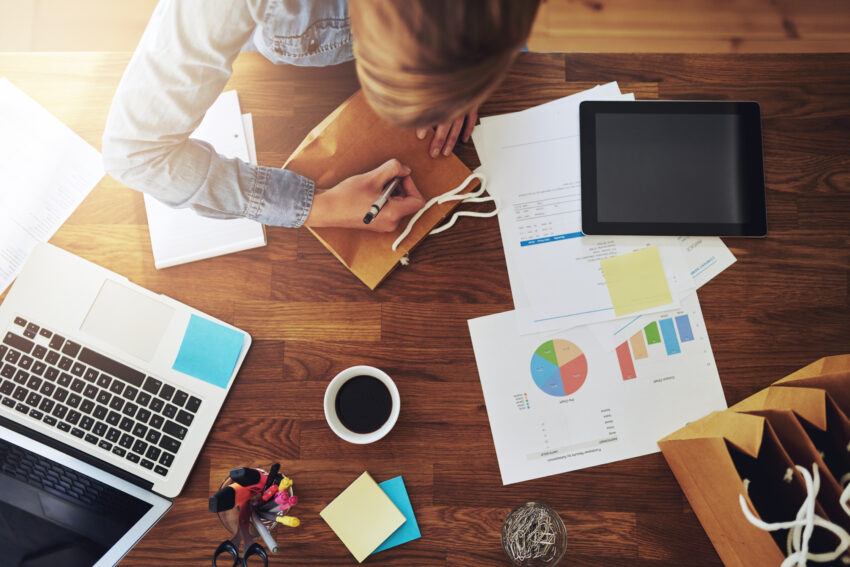 Young,Female,Entrepreneur,Working,In,A,Home,Office,At,Her