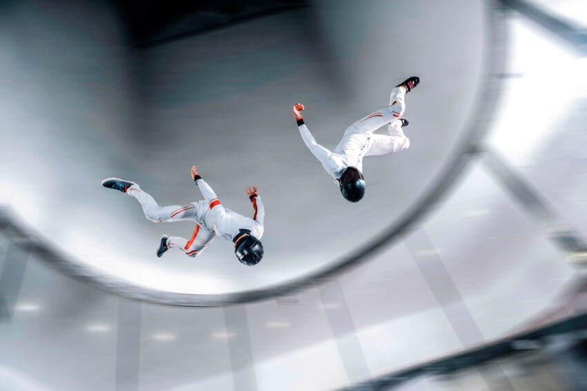 Fly,Men,Indoor,Skydive,Tunnel.,Two,Flyers,In,Wind,Tunnel.