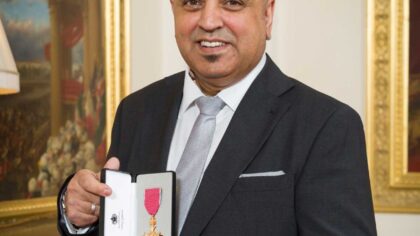 Headshot of Dr Amo Raju OBE, MD of Amo Raju & Associates