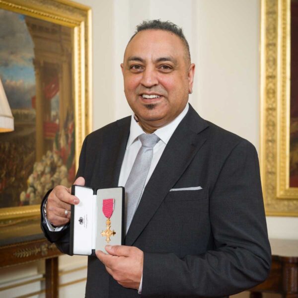 Headshot of Dr Amo Raju OBE, MD of Amo Raju & Associates